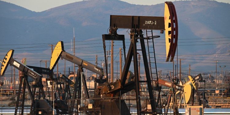 Active pump jacks increase pressure to draw oil toward the surface at the South Belridge Oil Field on February 26, 2022, in unincorporated Kern County, California, approximately 141 miles (227 km) northwest of Los Angeles, California. - From rural areas of the eastern states where modern oil production began to cities in southern California where pumpjacks loom not far from homes, lax regulations and the petroleum industrys boom and busts cycles have left the US pockmarked with perhaps hundreds of thousands of oil wells that are unsealed and haven't produced in decades. In a first, Washington is making a concerted effort to plug these wells by allocating $4.7 billion in federal infrastructure dollars to plug the wells in an effort to lessen the negative health and environmental impact of the disused wells. (Photo by Robyn BECK / AFP)