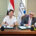 وليد جمال الدين و ويجو وانج أثناء توقيع الاتفاقية